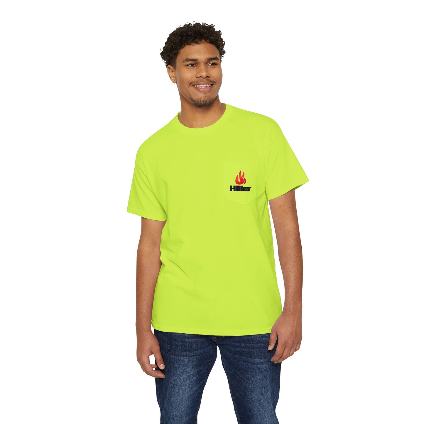 A man in a vibrant green Unisex Heavy Cotton Pocket Tee by Printify, featuring the Hiller Fire Guys flame logo, stands with a slight smile, highlighting the lightweight comfort of this stylish piece for firefighters and outdoor enthusiasts.