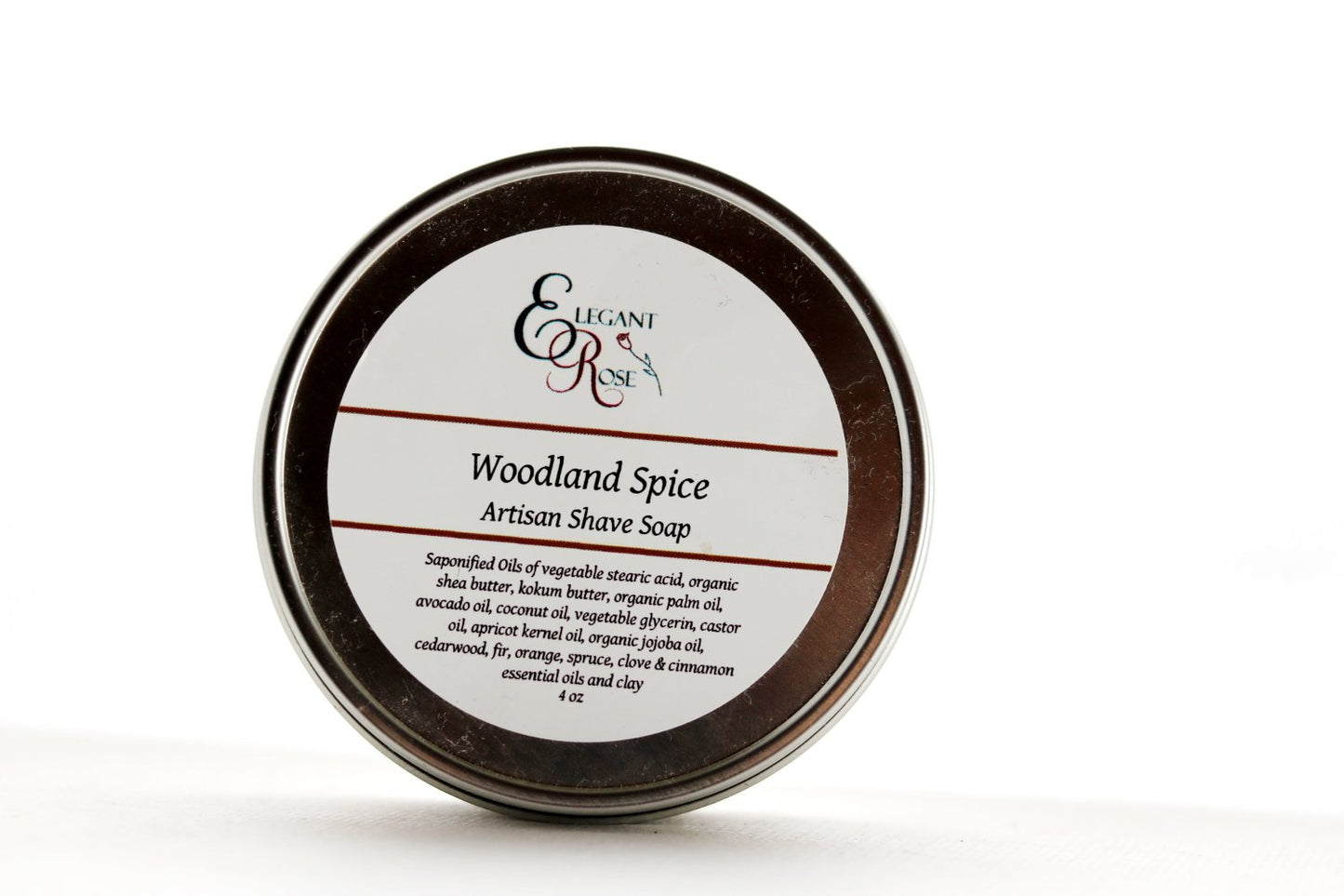 A round tin labeled "Woodland Spice Artisan Shave Soap, Natural Shaving" by Maroon Oliver, this vegan 4 oz soap uses all-natural ingredients to deliver a gentle, nourishing shaving experience.