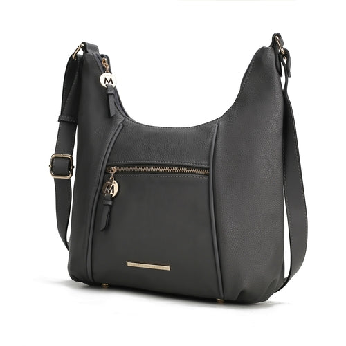 A Pink Orpheus Lavinia Vegan Leather Women's Shoulder Bag with a zippered closure.
