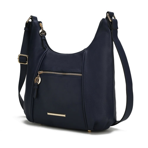 A Pink Orpheus Lavinia Vegan Leather Women’s Shoulder Bag with a zippered closure and gold-tone embellishments.