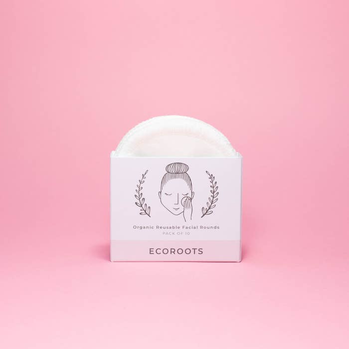 Efficient White Smokey Organic Makeup Remover wipes on a pink background.