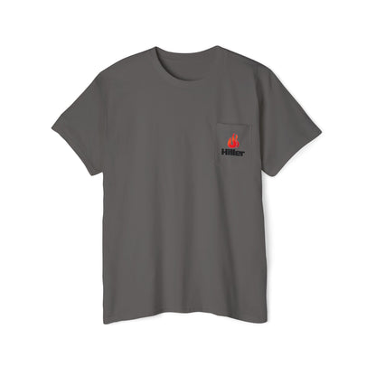 The Unisex Heavy Cotton Pocket Tee by Printify is ideal for outdoor activities. This casual gray t-shirt features a small pocket with a red flame logo and "Hiller" in sleek black text, perfect for firefighters and outdoor enthusiasts.