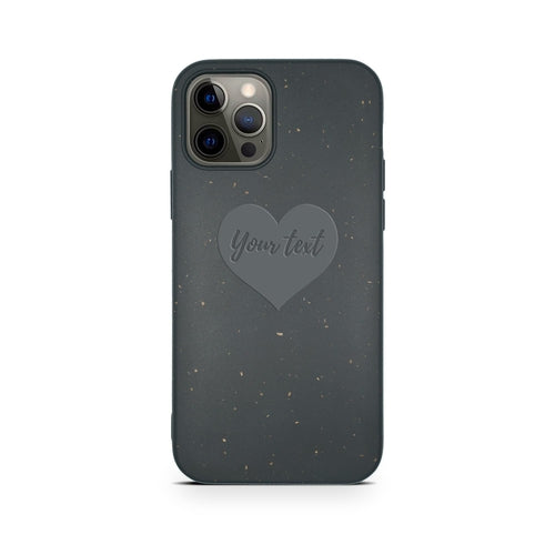 Dark grey, eco-friendly phone case featuring a heart design in the center with the words "Biodegradable Personalized Iphone Case - Black." The case has a speckled pattern and is designed for a phone with multiple camera lenses. Brand: Tan Lily.