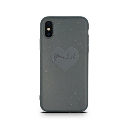 A smartphone case with a speckled gray design and a personalized heart-shaped area containing the text "Your text" - Biodegradable Personalized Iphone Case - Black by Tan Lily.