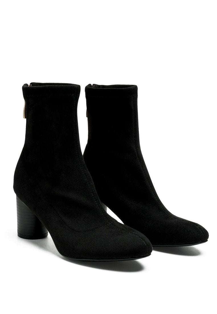A pair of black Vegan Micro Suede Ankle Boots with block heels by Ruby Smudge on a white background.