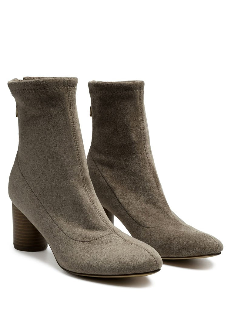 A pair of beige Vegan Micro Suede Ankle Boots with block heels by Ruby Smudge.