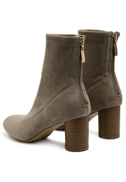 A pair of taupe Vegan Micro Suede ankle boots from Ruby Smudge with block heels and side zippers.