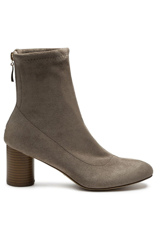 A single taupe Ruby Smudge vegan micro suede ankle boot with a stacked heel and a zipper closure on the back.