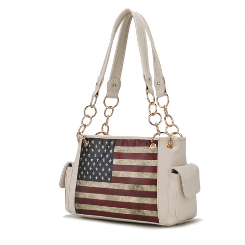 The Pink Orpheus Alaina Vegan Leather Women's Flag Shoulder Bag combines style and functionality with its white design and American flag motif. It is made of vegan leather, making it both fashionable and ethical.