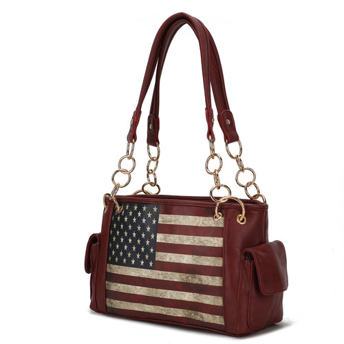 A Pink Orpheus Alaina Vegan Leather Women's Flag Shoulder Bag in burgundy offers both style and functionality with its American flag design. Made with vegan leather, this handbag is the perfect patriotic accessory.
