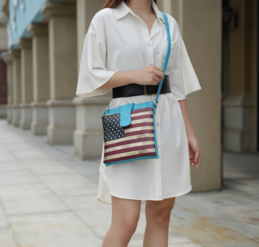 A woman wearing a white dress and carrying a Pink Orpheus Josephine Vegan Leather Women FLAG Crossbody Bag.