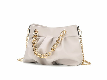 A Marvila Minimalist Vegan Leather Chain Ruched Shoulder Bag by Pink Orpheus, a fashion-forward white handbag with gold chain handles made of vegan leather.