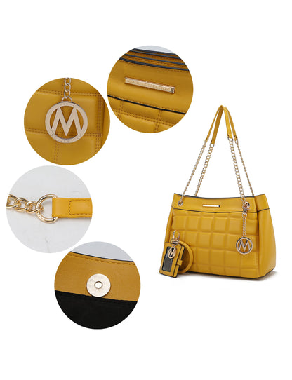 A Pink Orpheus Mabel Quilted Vegan Leather Women Shoulder Bag with Bracelet Keychain with the letter m on it.