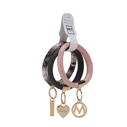 Three Jasmine Vegan Leather Women Bangle Wristlet Keychains with luxurious decorative charms attached to a white display tag by Pink Orpheus.