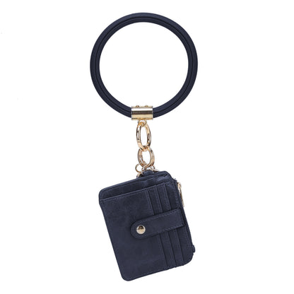 A black Jordyn Vegan Leather Bracelet Keychain with a Credit Card Holder and Pink Orpheus clasp.
