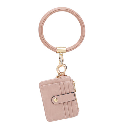 Beige card wallet with a Pink Orpheus Jordyn Vegan Leather Bracelet Keychain with a Credit Card Holder.
