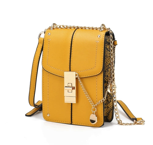 A Iona Crossbody Handbag Vegan Leather Women by Pink Orpheus with a gold chain.
