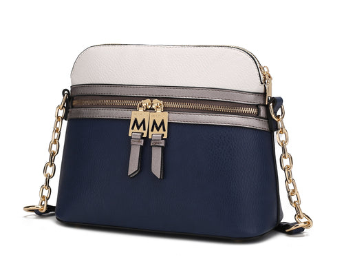 A sustainable vegan leather Karelyn Crossbody Handbag in blue and white with a gold chain by Pink Orpheus.