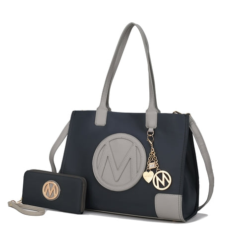 A Pink Orpheus Louise Tote Handbag and Wallet Set Vegan Leather with the letter m.