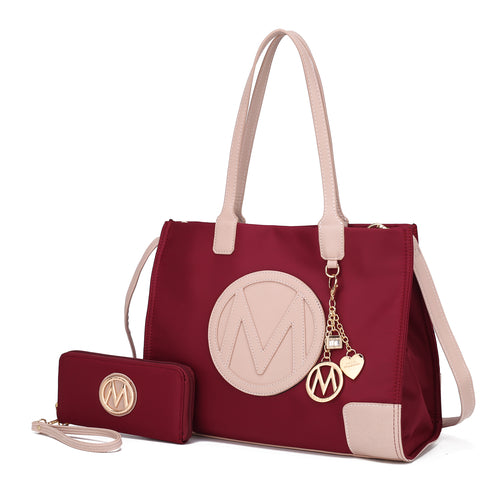 A Louise Tote Handbag and Wallet Set Vegan Leather by Pink Orpheus with the letter m.