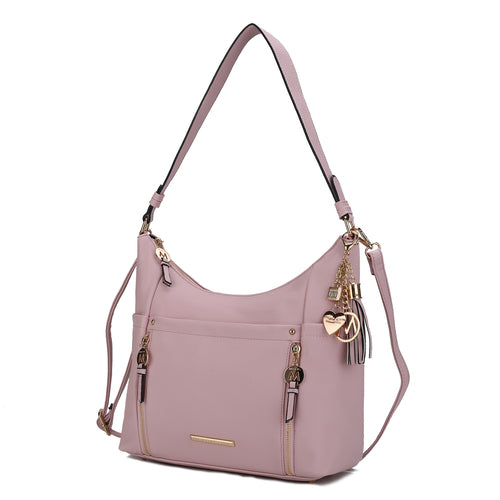 Sustainable Ruby Vegan Leather Women Shoulder Bag with decorative charms and adjustable strap, crafted from Pink Orpheus.