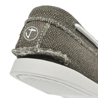 Close-up of the back of a gray fabric shoe with visible stitching, white laces, a small white circular logo, and a natural rubber sole with the word "SEA JURE" embossed on it. These Men Hemp & Vegan Boat Shoe Scopello by Amethyst Hestia offer a stylish look crafted from premium hemp materials.
