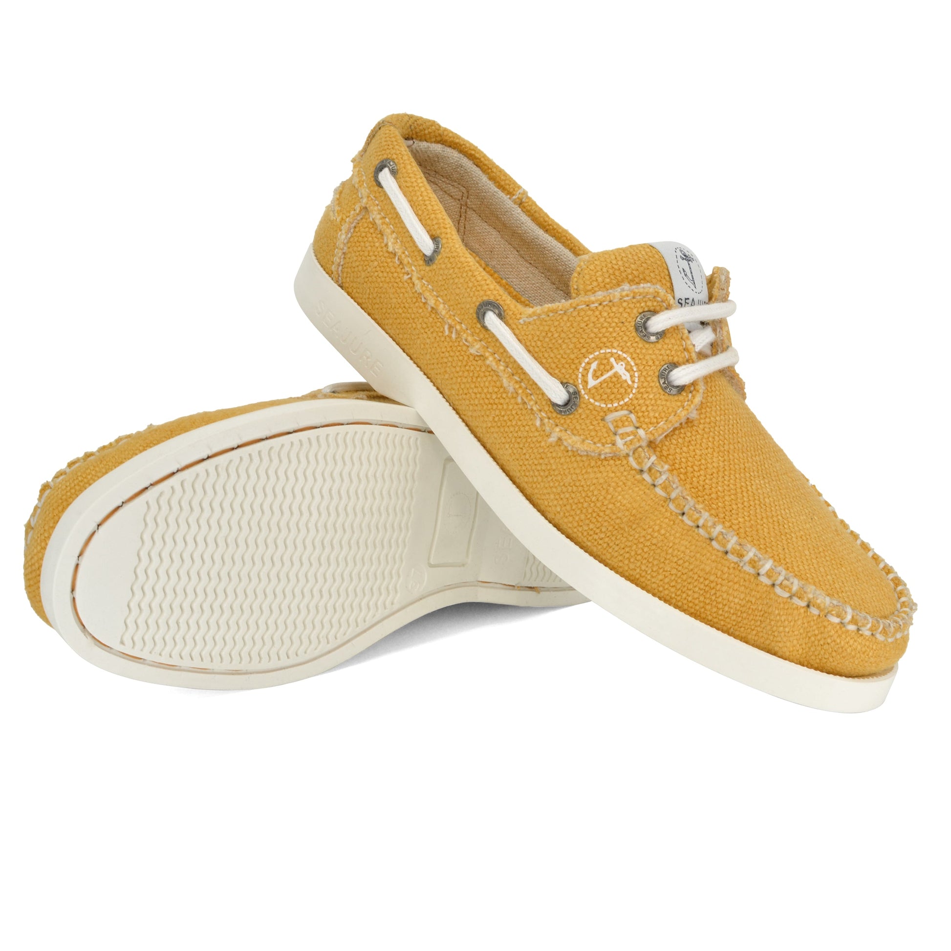 A pair of yellow Amethyst Hestia Women Hemp & Vegan Boat Shoe Saharun with white rubber soles, showing both the top and bottom views. The shoes, made from premium hemp for sustainability, have white laces and stitching details.