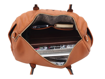 A Luana Quilted Vegan Leather Women's Duffle Bag by Pink Orpheus with a laptop and other items inside.