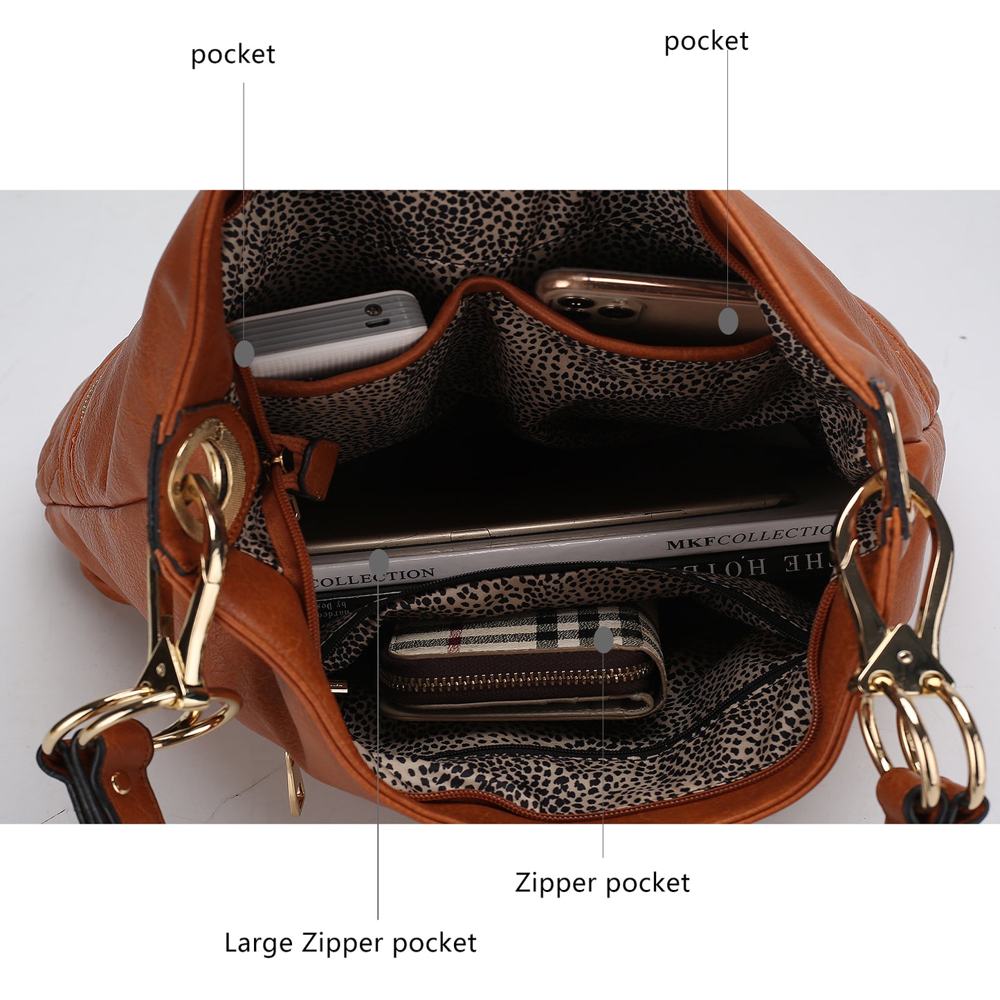 A stylish Dalila Vegan Leather Women Shoulder Handbag made with vegan leather, containing the essential contents of a purse, including a cell phone, from the brand Pink Orpheus.