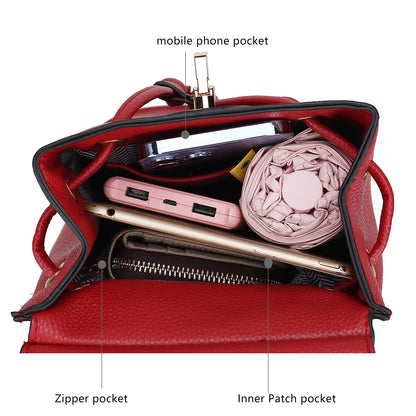 The contents of a classy Pink Orpheus Serafina Vegan Leather Womens Backpack with a cell phone in it.