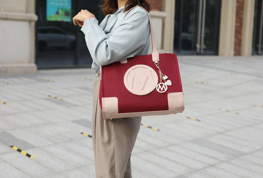 A woman is holding a Pink Orpheus Louise Tote Handbag and Wallet Set Vegan Leather.