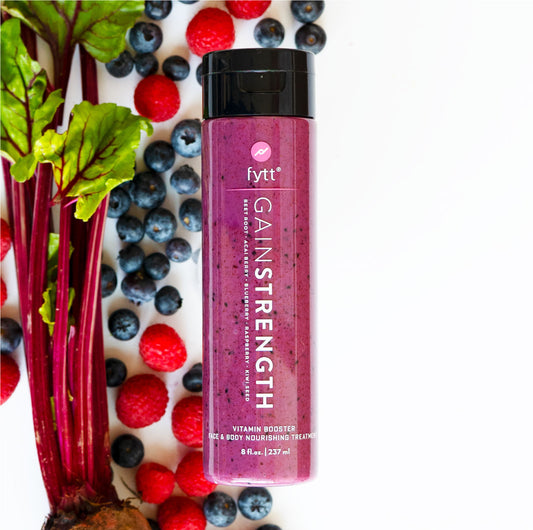 A bottle of Ultra-Nourishing Exfoliating Mask surrounded by berries, brand Cyan Ares.