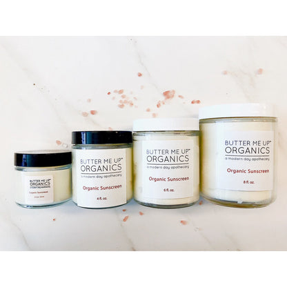 Three jars of White Smokey's Natural Organic Sunscreen, containing SPF 45 Sunscreen and Non-Nano Zinc Oxide, on a marble countertop.