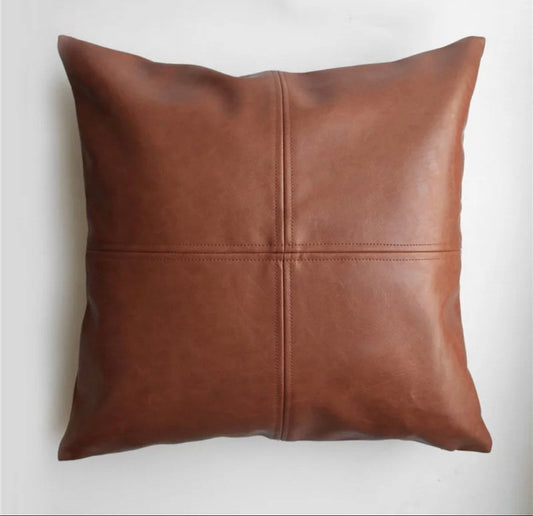 Brown Magenta Charlie vegan leather pillow cover with a stitched design, displayed on a light background.