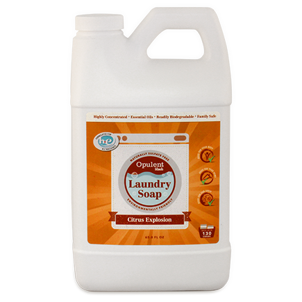 Plastic jug of "White Lavender" eco-friendly Natural Laundry Soap - Citrus Explosion labeled as Citrus Explosion scent, 64 fl oz size, with orange and yellow label.