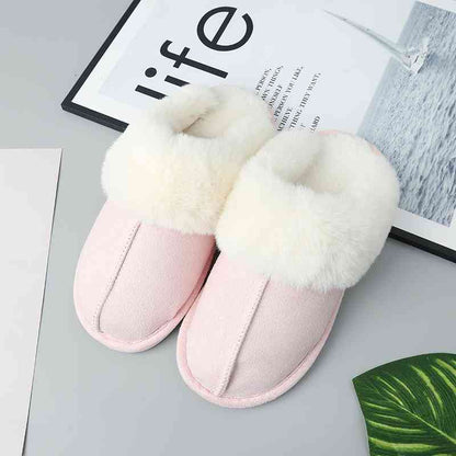 A pair of comfortable Trendsi vegan suede center seam slippers with fur lining.