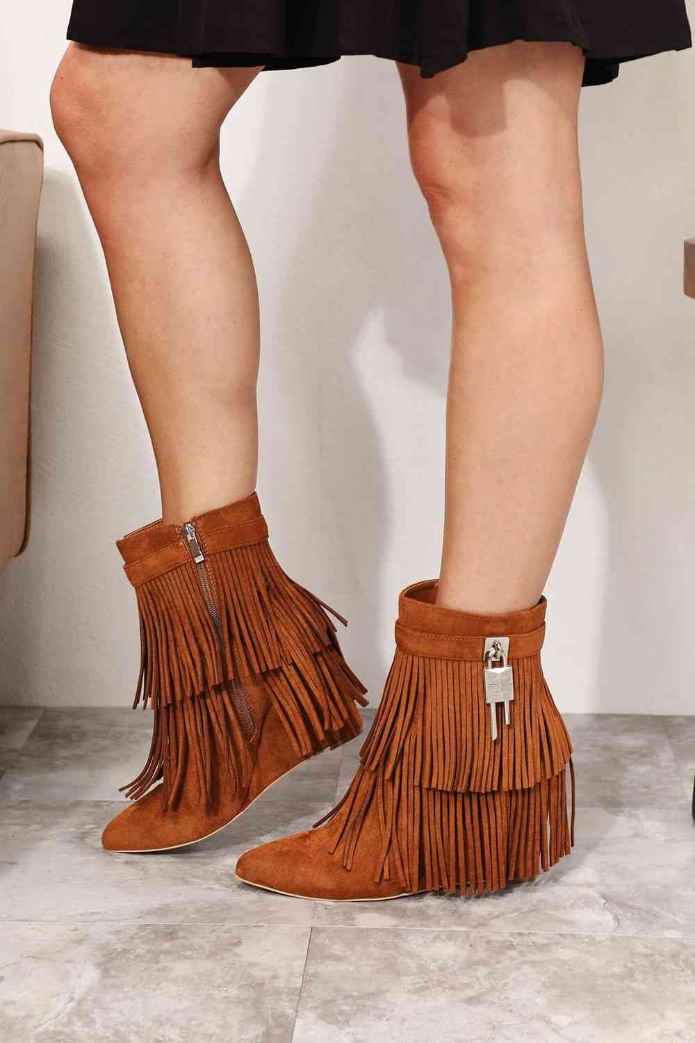 Legend Women's Tassel Wedge Heel Ankle Booties by Trendsi, tan vegan suede ankle booties with a fringe accent, featuring an open shank design.