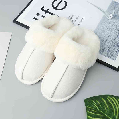 A pair of Trendsi Vegan Suede Center Seam Slippers with vegan suede and fur on top.